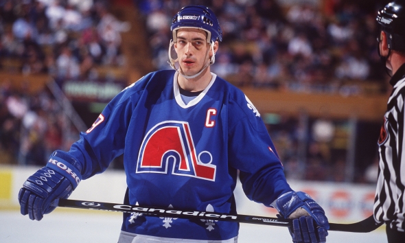 I'll line up for a jersey if they come back as the Nordiques, with something like this look.